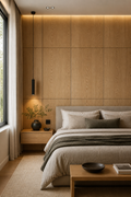 Modern bedroom with wooden paneling, bed, and side table.