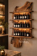 Walnut slab wine rack with three shelves and hanging stemware in a softly lit home bar